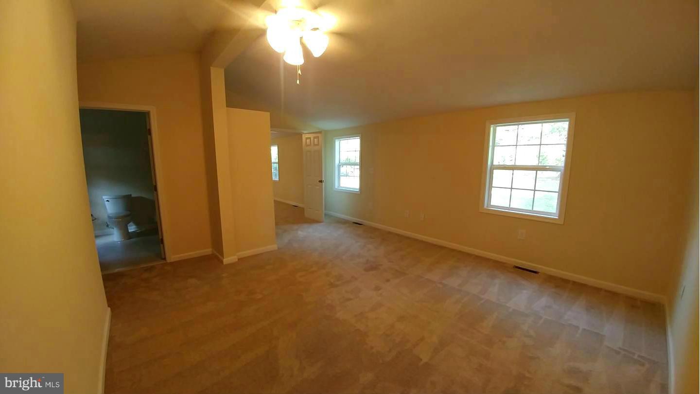 7435 Simms Landing Road Port Tobacco, MD 20677 - Photo 11 of 26 an empty room with a bathroom