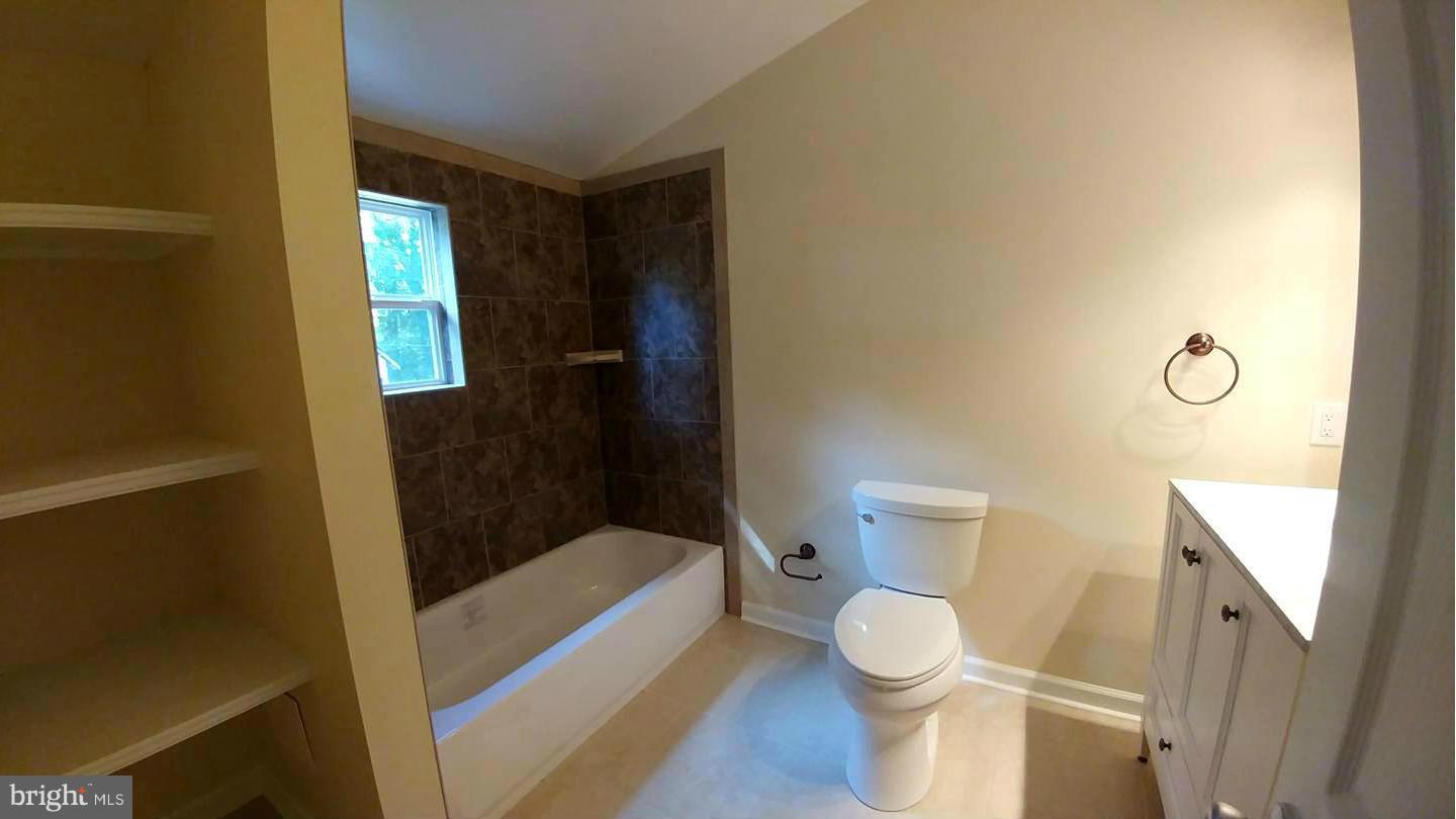 7435 Simms Landing Road Port Tobacco, MD 20677 - Photo 16 of 26 a bathroom with a toilet and a shower