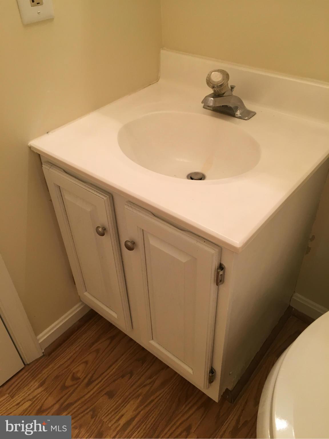 7435 Simms Landing Road Port Tobacco, MD 20677 - Photo 17 of 26 a bathroom with a sink and a mirror