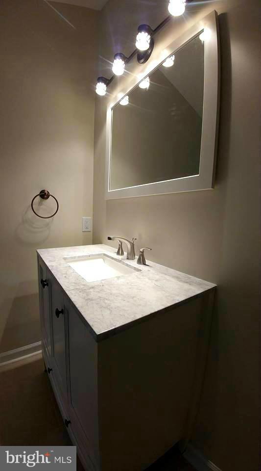 7435 Simms Landing Road Port Tobacco, MD 20677 - Photo 19 of 26 a bathroom with a sink and a mirror
