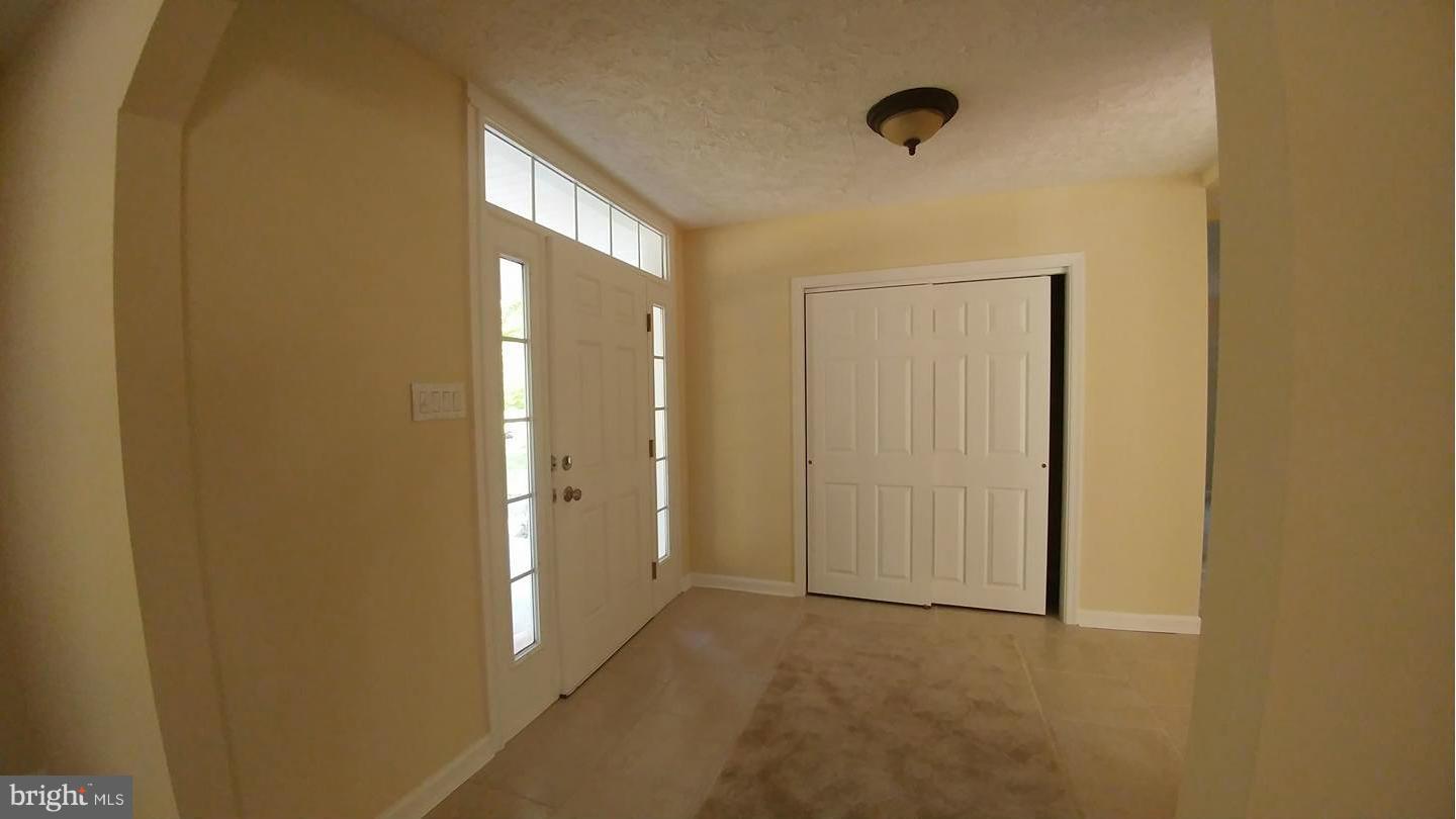 7435 Simms Landing Road Port Tobacco, MD 20677 - Photo 3 of 26 a view of an empty room