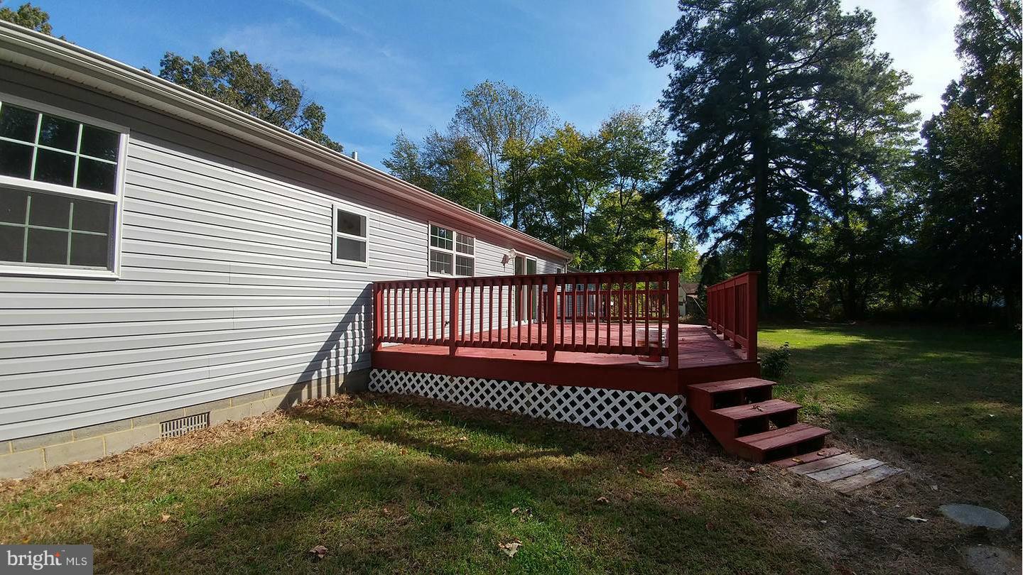 7435 Simms Landing Road Port Tobacco, MD 20677 - Photo 23 of 26 a view of a yard in front of a house with a fence