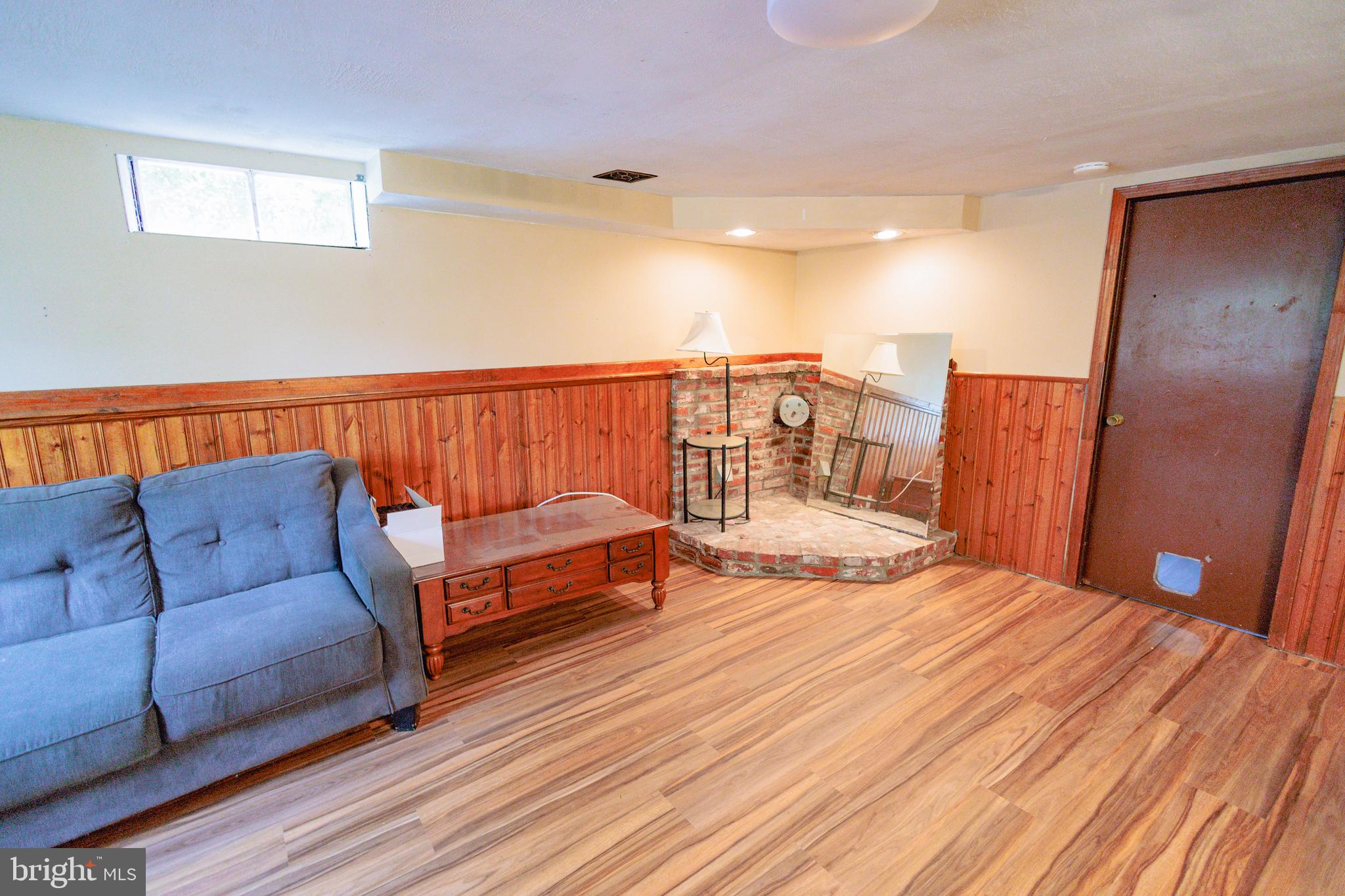 419 University Boulevard Glassboro, NJ 08028 - Photo 14 of 30 a bedroom with a bed and wooden floor