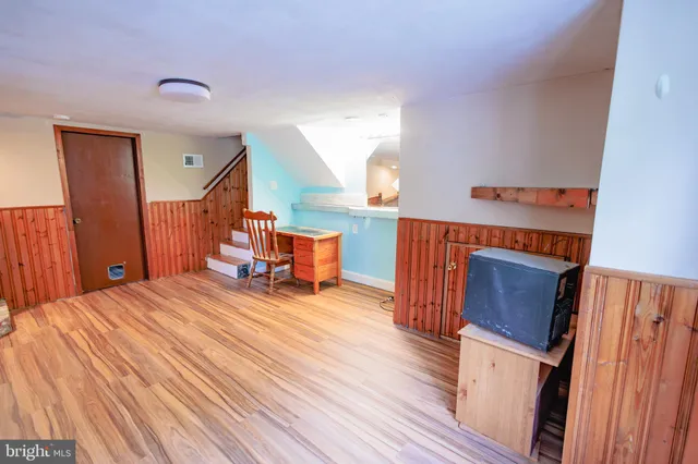 a bed room with a bed and wooden floor