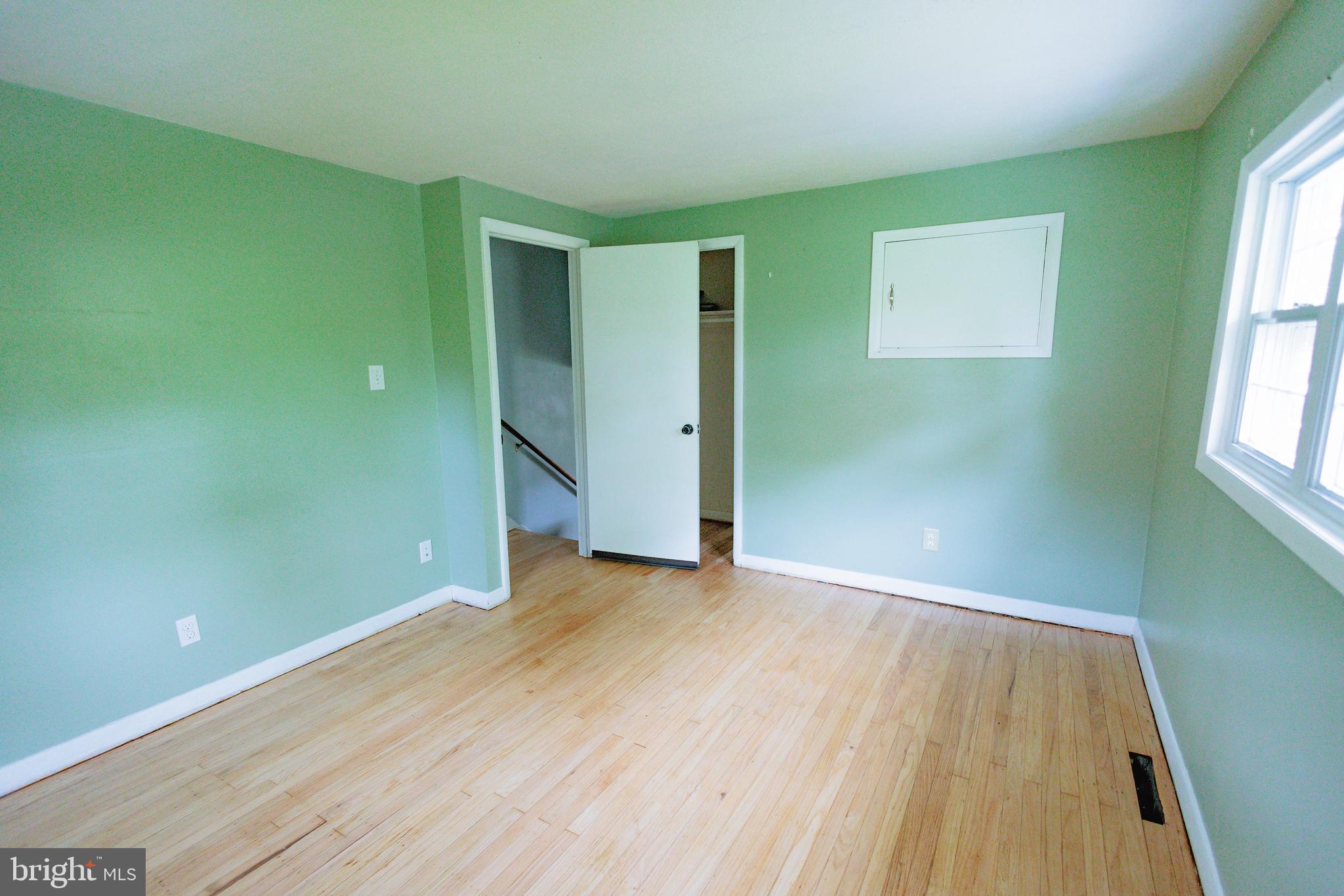 419 University Boulevard Glassboro, NJ 08028 - Photo 22 of 30 an empty room with wooden floor and windows