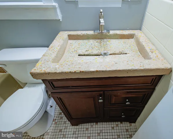 a bathroom with a sink and mirror
