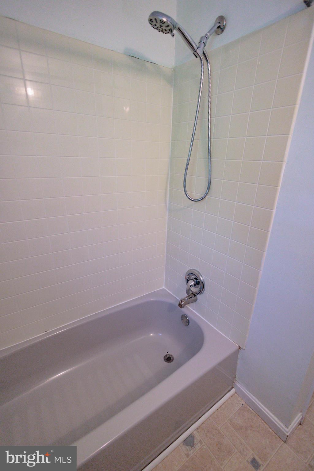 419 University Boulevard Glassboro, NJ 08028 - Photo 29 of 30 a bathroom with a bath tub and a shower