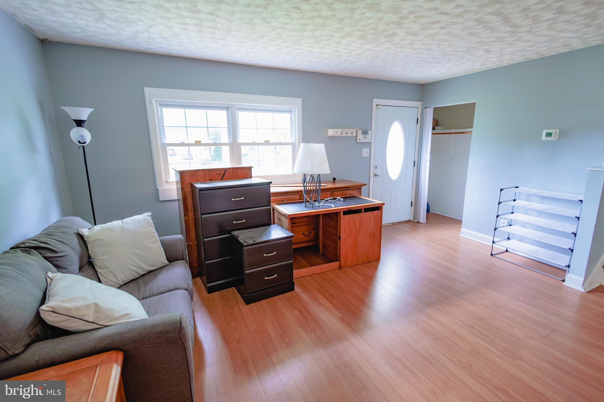 419 University Boulevard Glassboro, NJ 08028 - Photo 9 of 30 a living room with furniture and wooden floor
