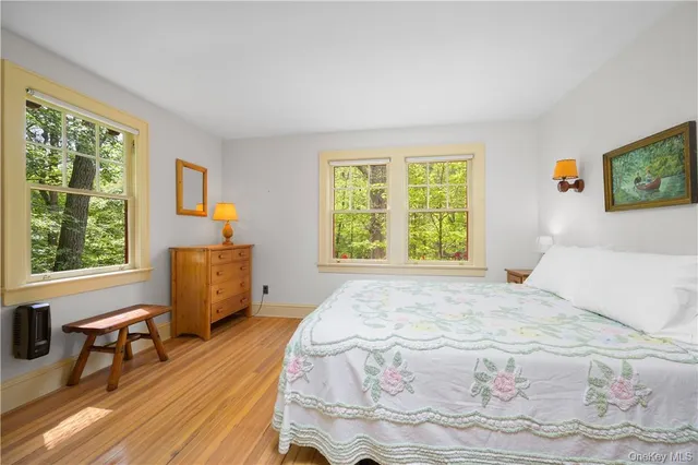 a bedroom with a bed and a table