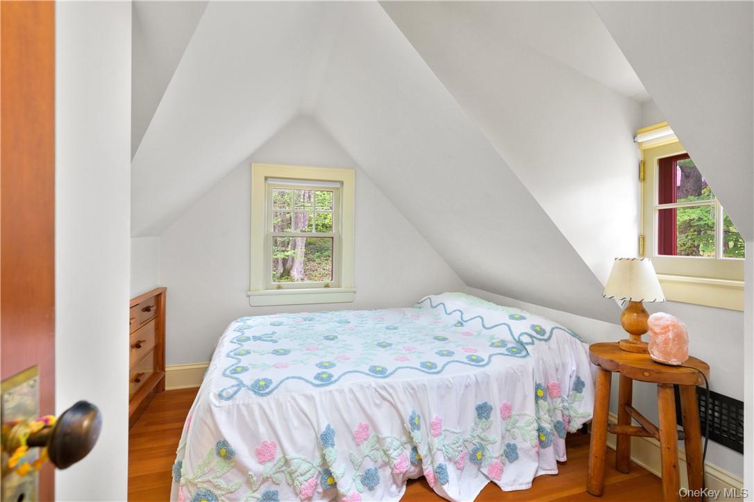 77 Lake Drive Cold Spring, NY 10516 - Photo 18 of 49 a bedroom with a bed and wooden floor