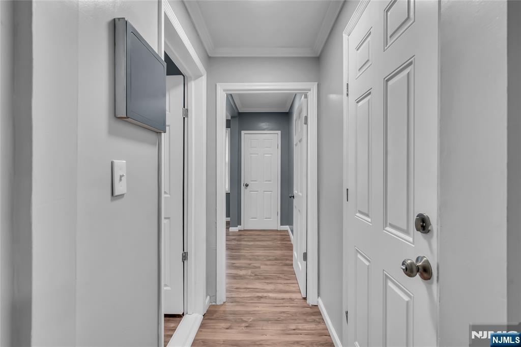 537 Scotland Road, Unit 2 Orange, NJ 07050 - Photo 13 of 17 a view of a hallway with wooden floor and closet area