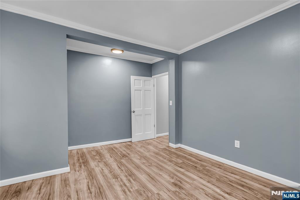 537 Scotland Road, Unit 2 Orange, NJ 07050 - Photo 10 of 17 a view of empty room with wooden floor
