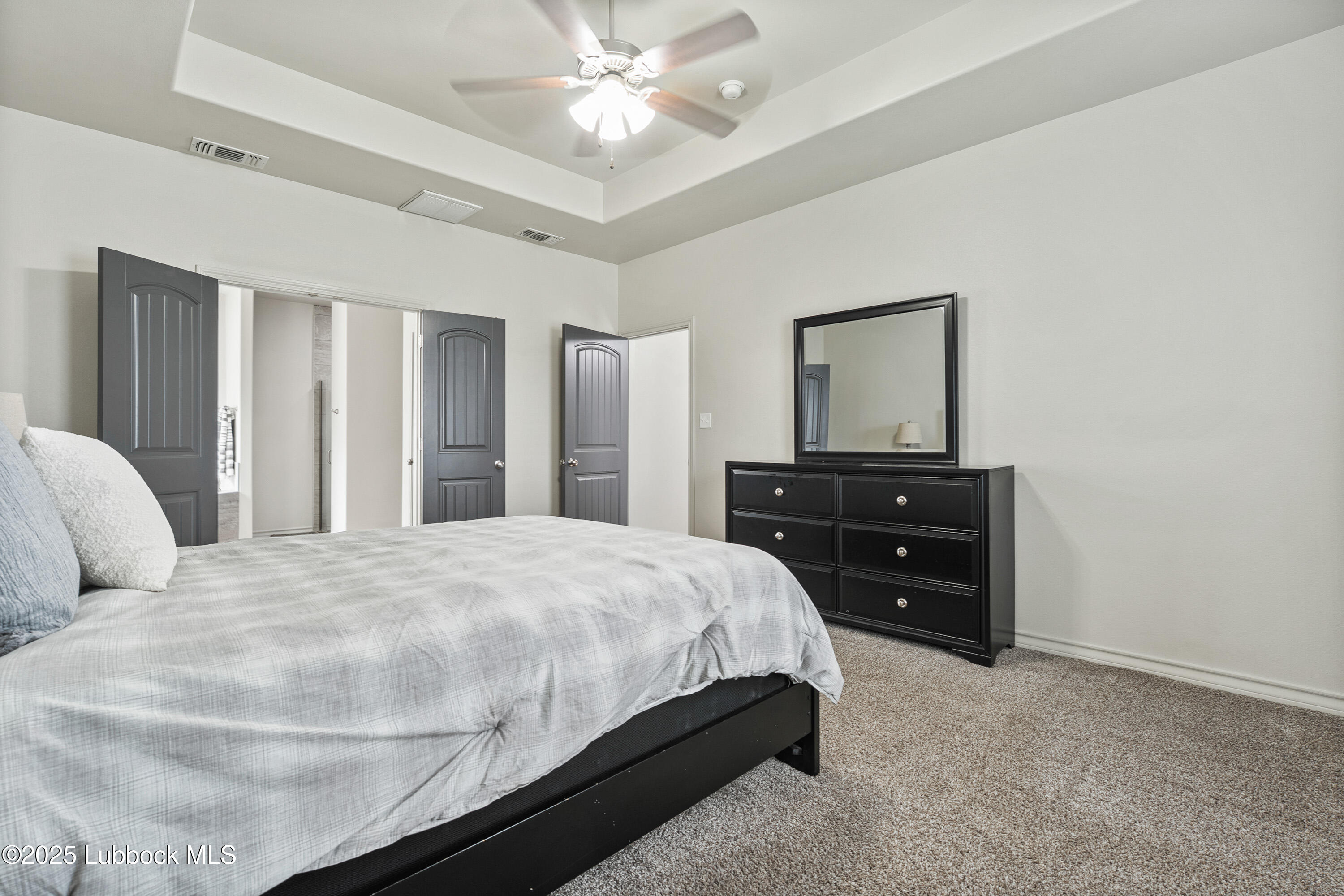 5303 Lehigh Street Lubbock, TX 79416 - Photo 15 of 31 a bedroom with a bed and closet