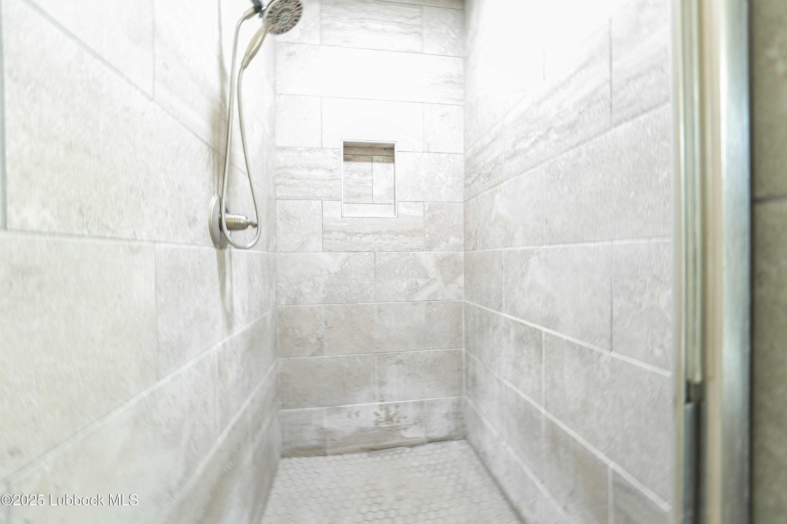 5303 Lehigh Street Lubbock, TX 79416 - Photo 18 of 31 a bathroom with a glass shower door