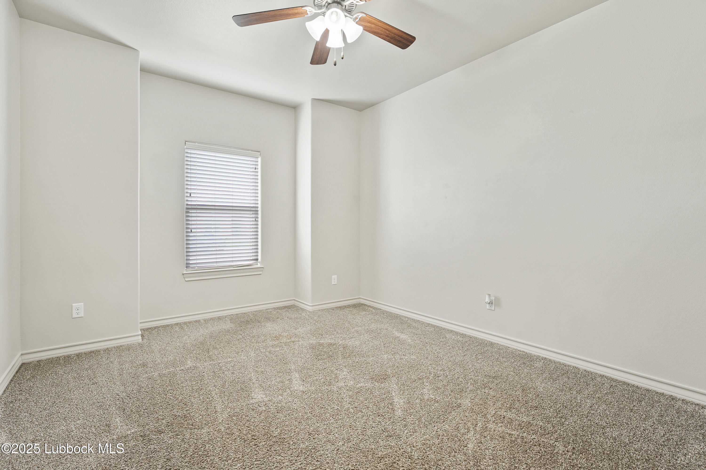 5303 Lehigh Street Lubbock, TX 79416 - Photo 20 of 31 an empty room with a chandelier fan