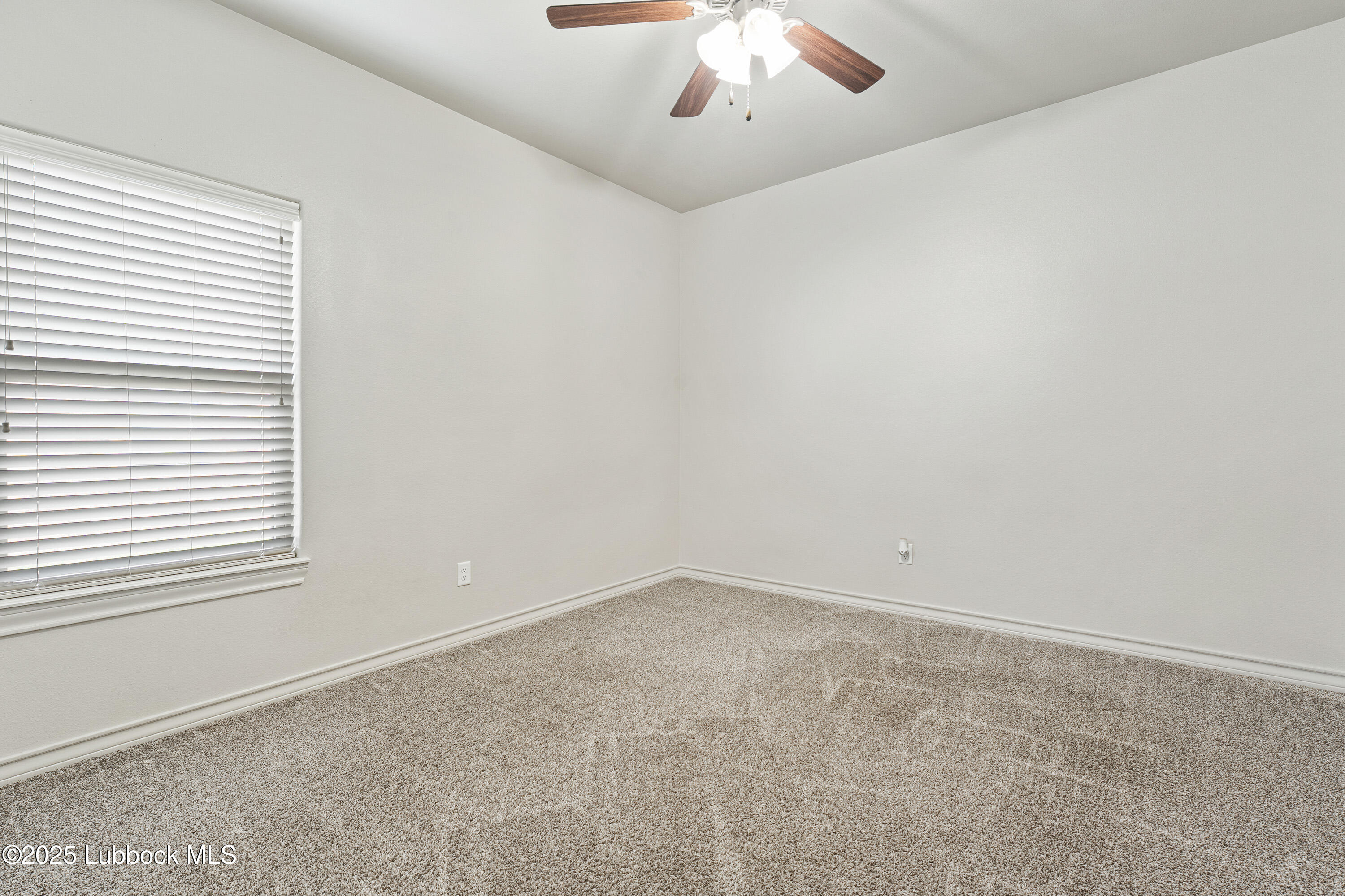 5303 Lehigh Street Lubbock, TX 79416 - Photo 22 of 31 an empty room with a window