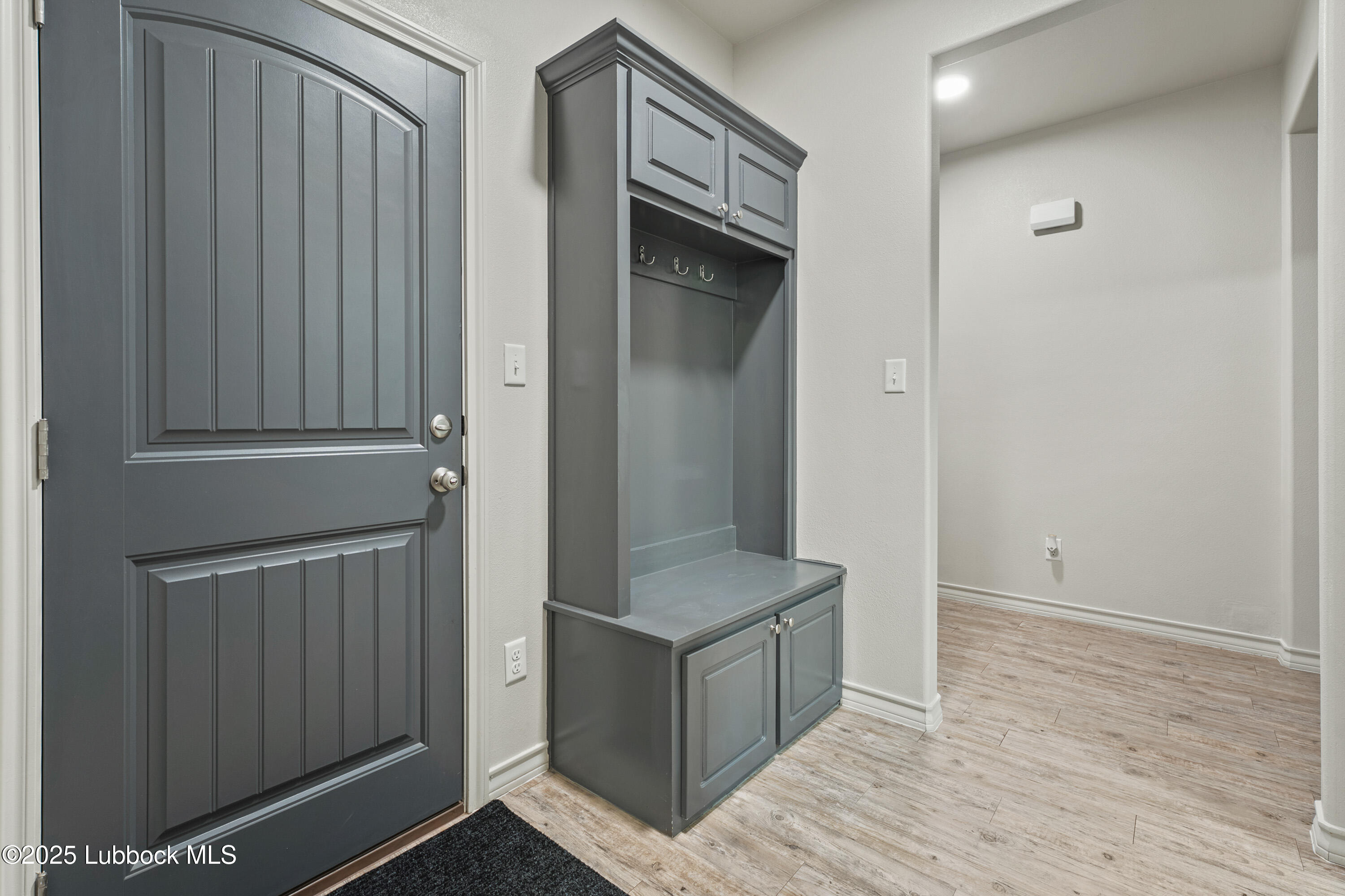 5303 Lehigh Street Lubbock, TX 79416 - Photo 26 of 31 a view of an entryway with wooden floor