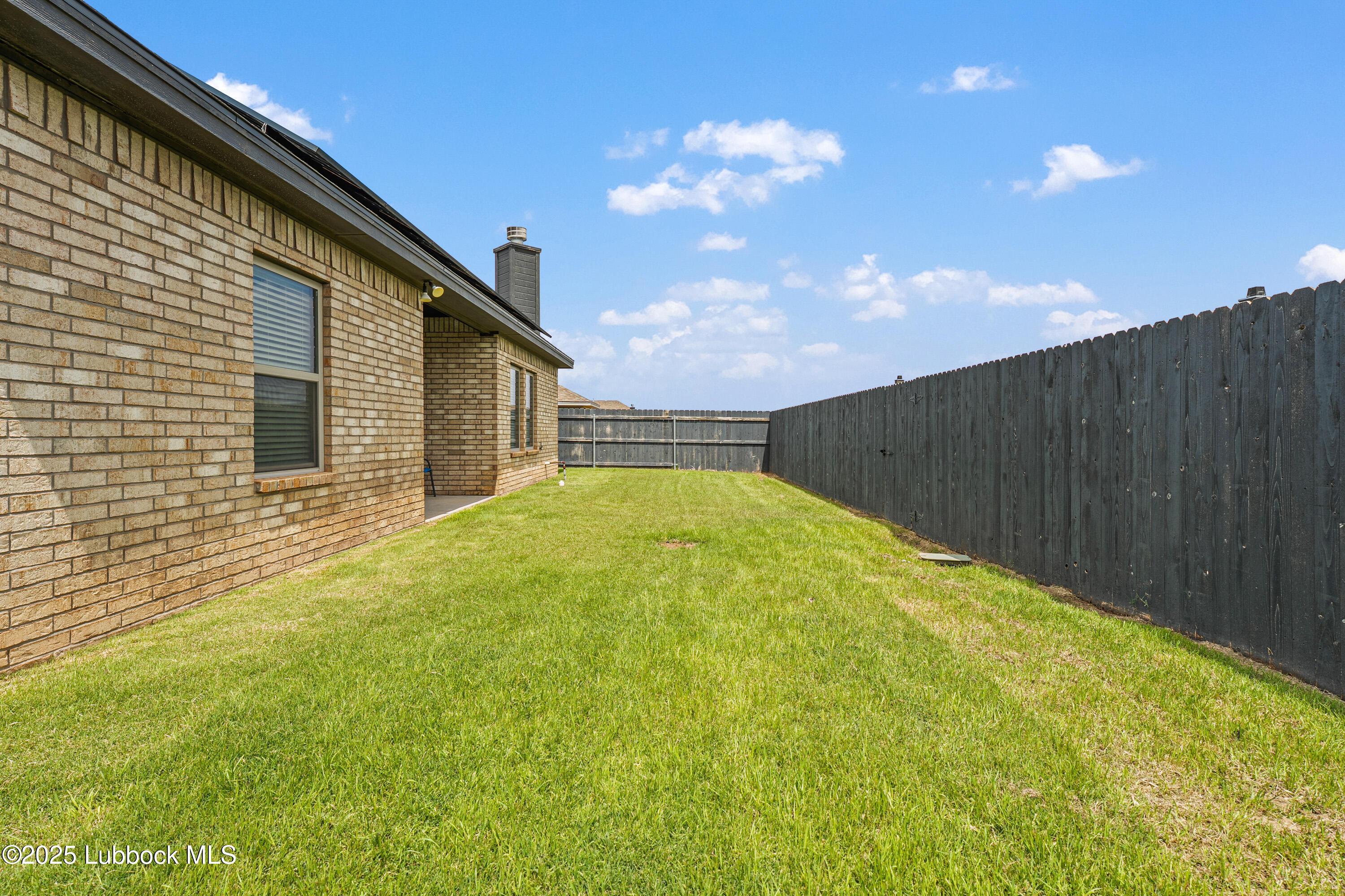 5303 Lehigh Street Lubbock, TX 79416 - Photo 30 of 31 a backyard of a house