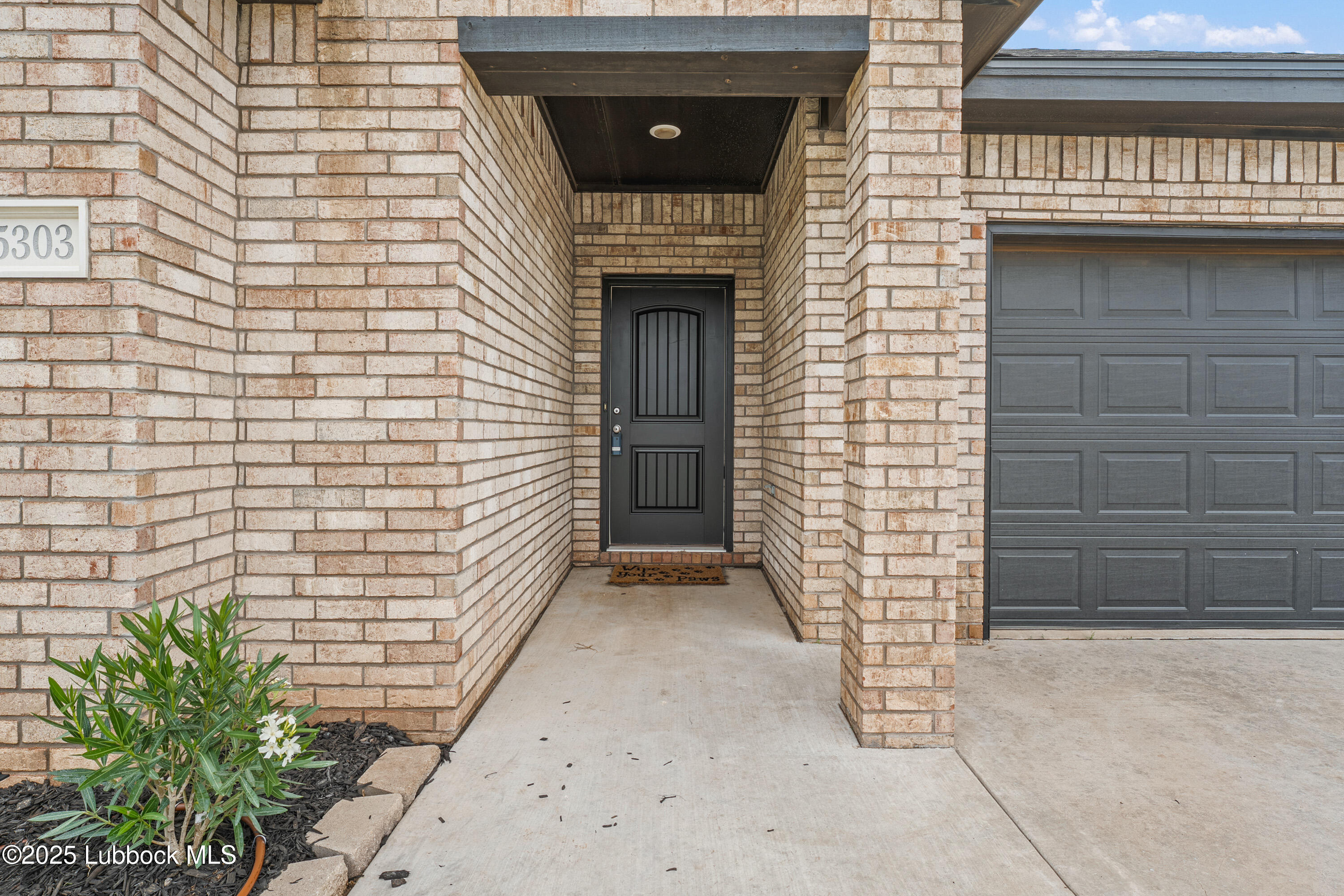 5303 Lehigh Street Lubbock, TX 79416 - Photo 3 of 31 a front view of a house with entryway