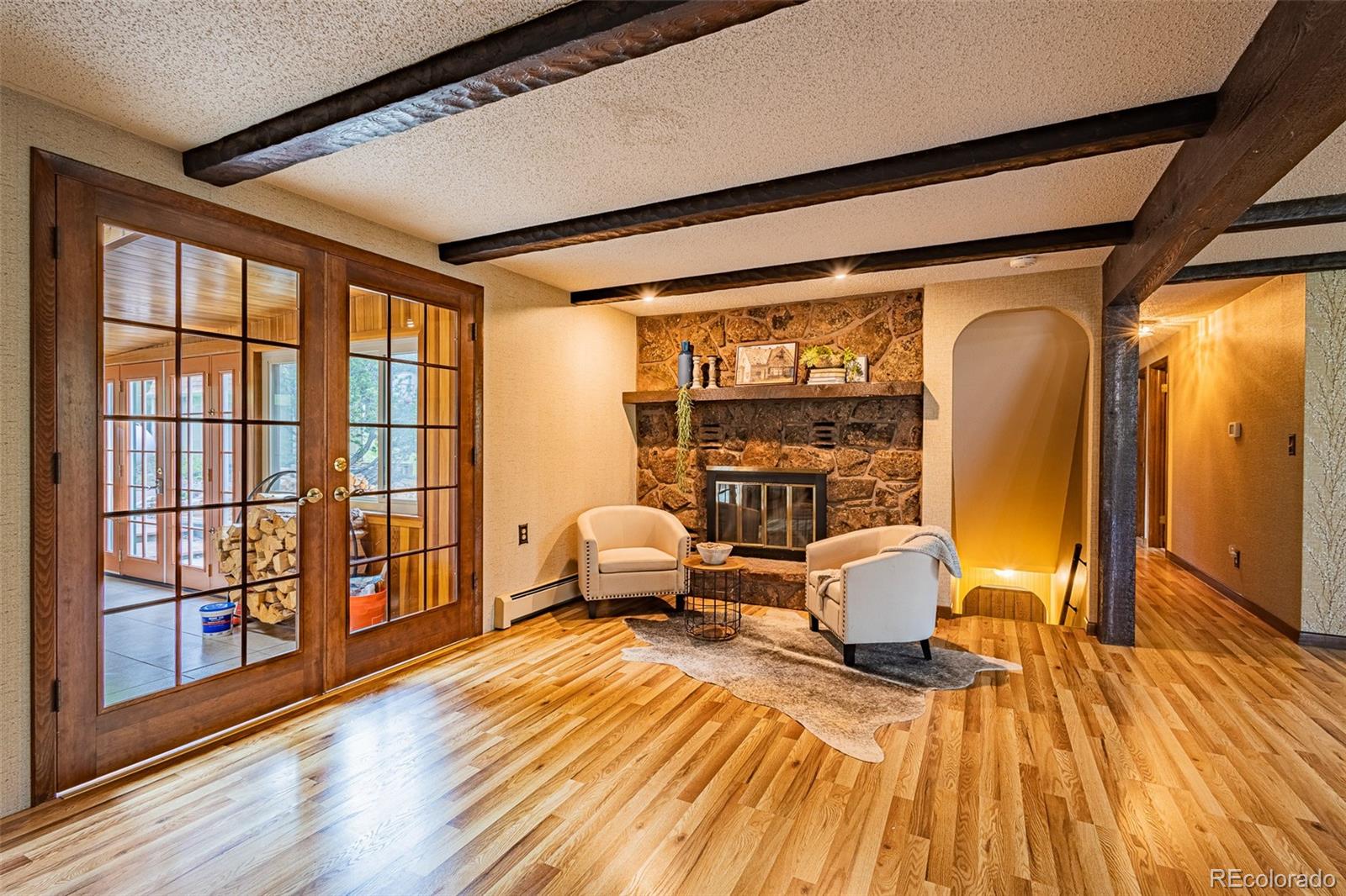 98 Button Rock Road Lyons, CO 80540 - Photo 11 of 40 a living room with furniture a large window