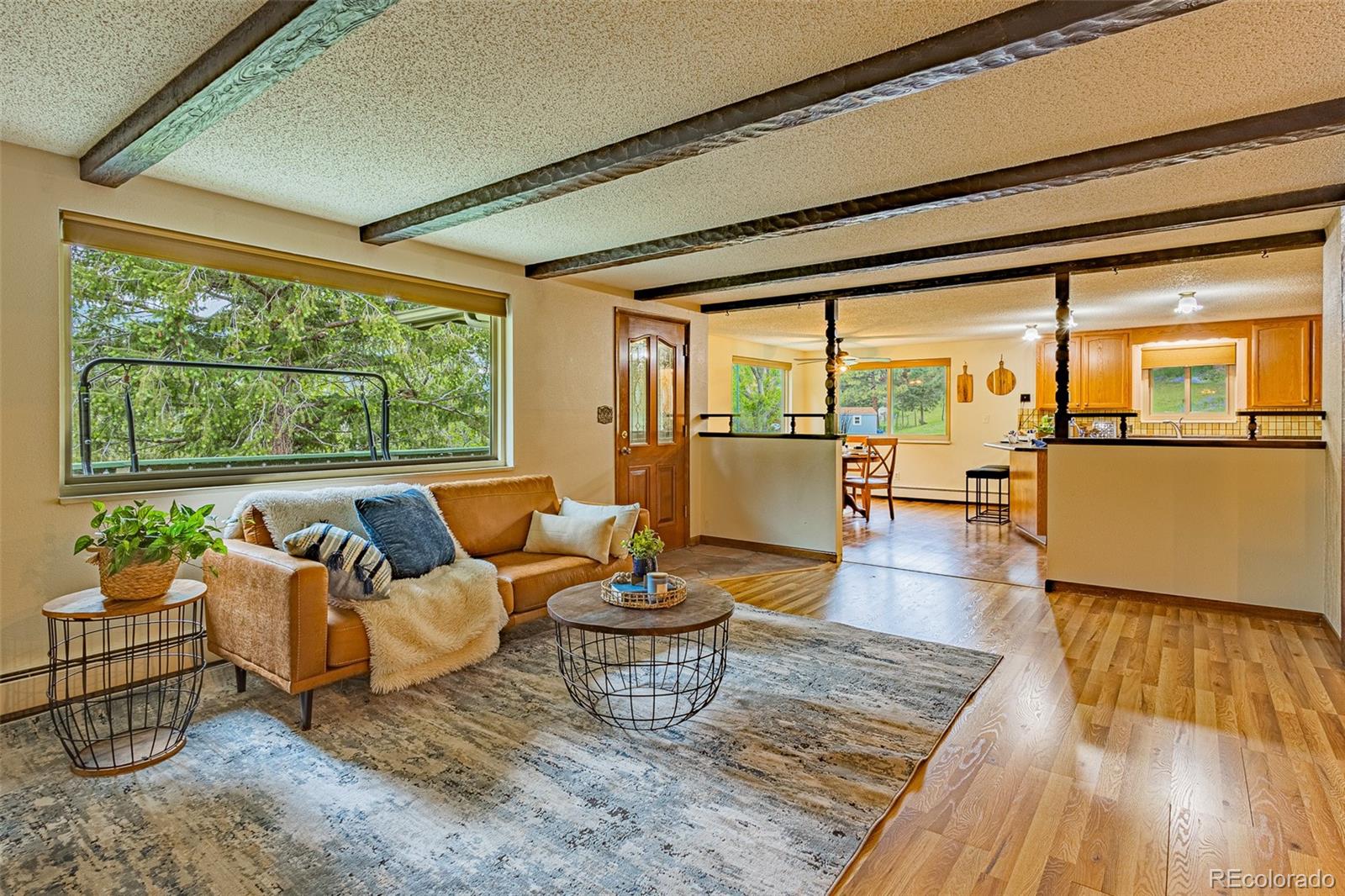 98 Button Rock Road Lyons, CO 80540 - Photo 8 of 40 a living room with furniture and a wooden floor