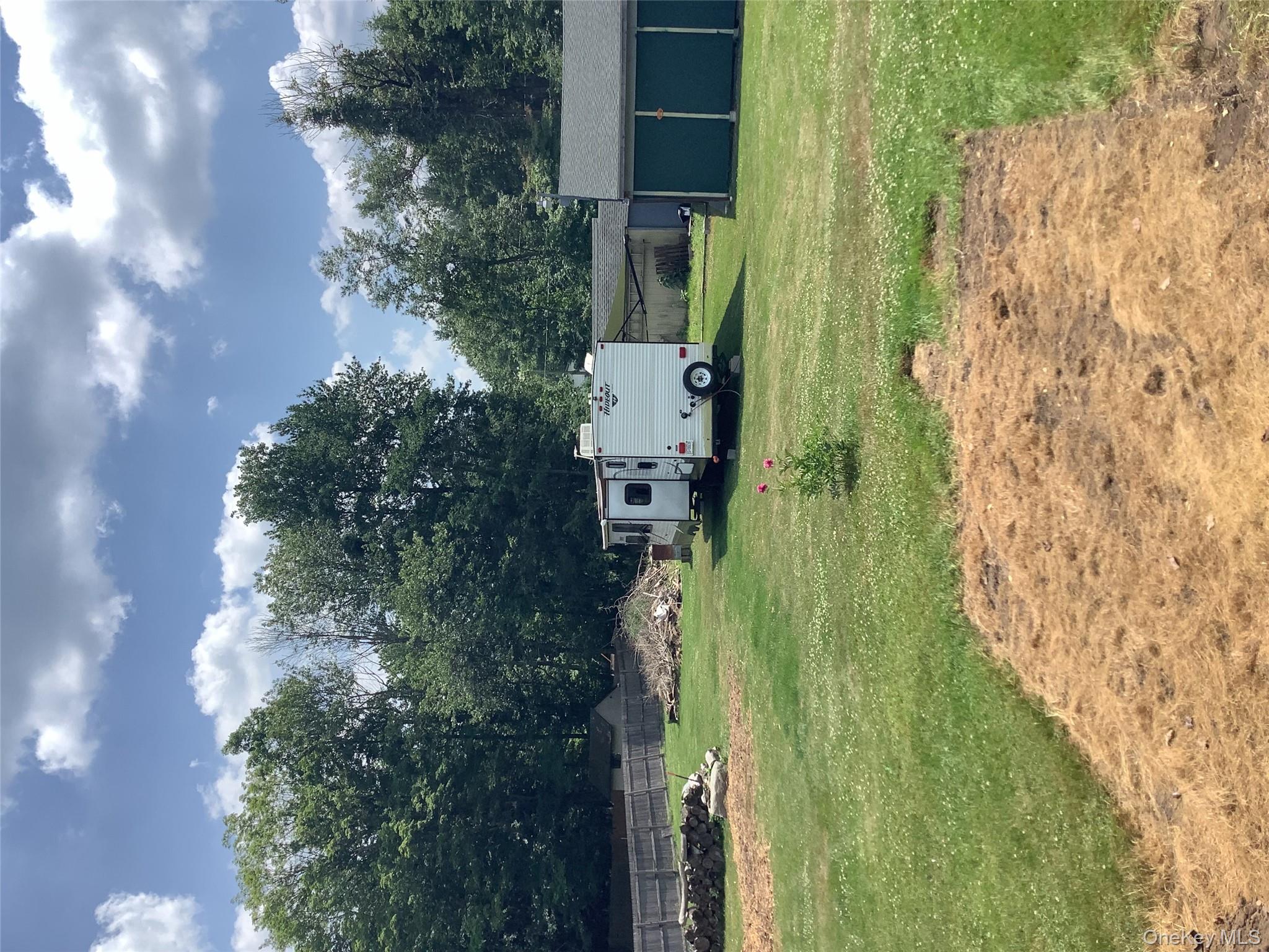 279 Cold Spring Road Monticello, NY 12701 - Photo 25 of 32 View of yard with an outbuilding