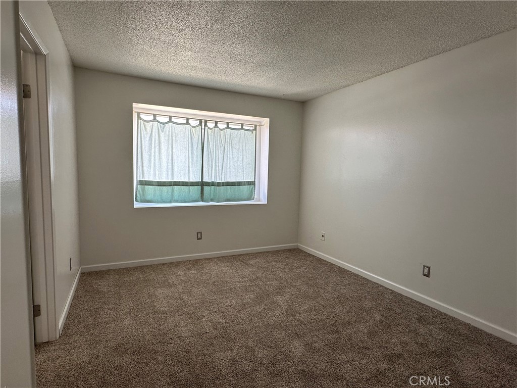 1624 Forane Street Barstow, CA 92311 - Photo 19 of 30 an empty room with a window