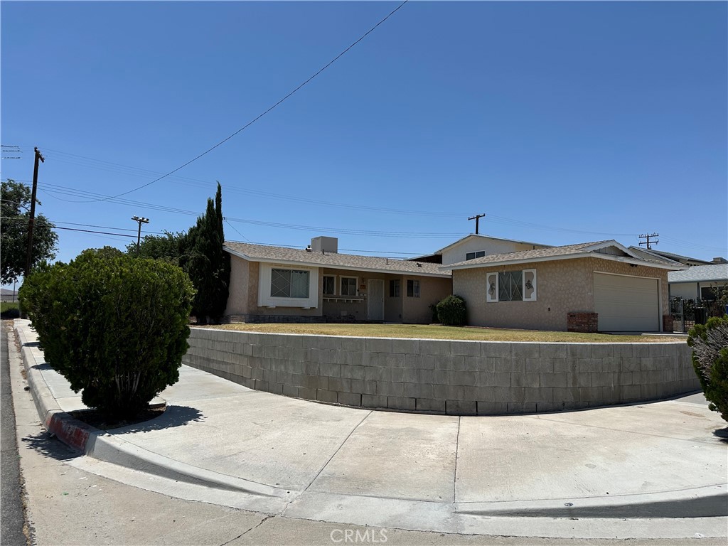 1624 Forane Street Barstow, CA 92311 - Photo 2 of 30 a front view of a house with a yard