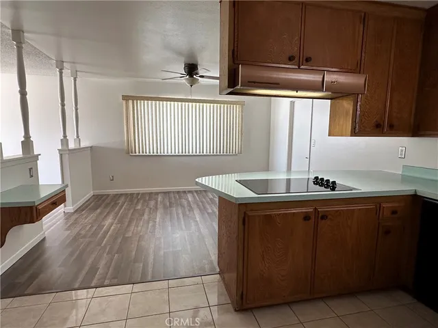 a kitchen with wooden cabinets and a sink