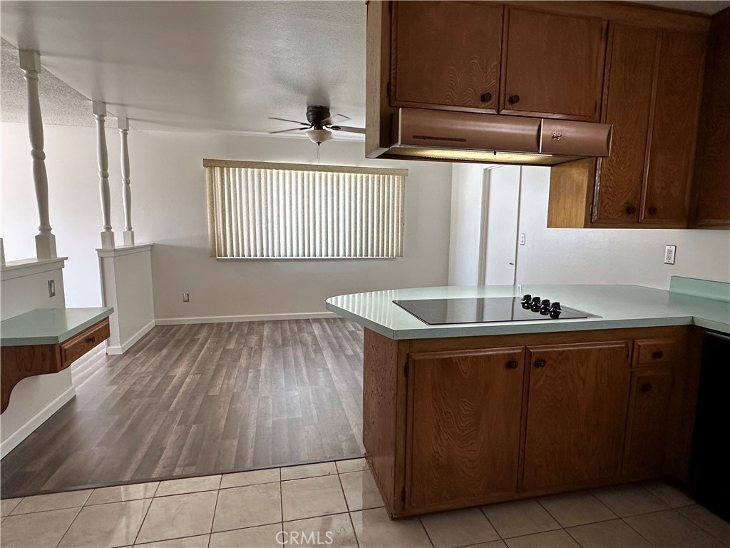 1624 Forane Street Barstow, CA 92311 - Photo 6 of 30 a kitchen with wooden cabinets and a sink