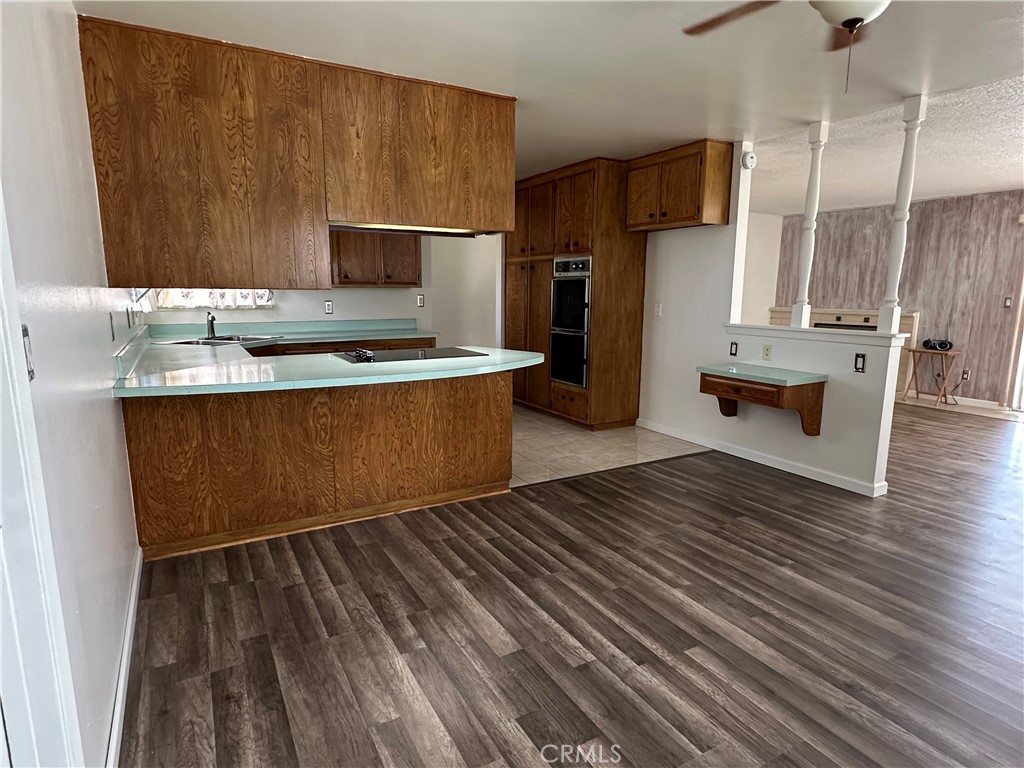 1624 Forane Street Barstow, CA 92311 - Photo 8 of 30 a kitchen with stainless steel appliances a refrigerator and a stove top oven
