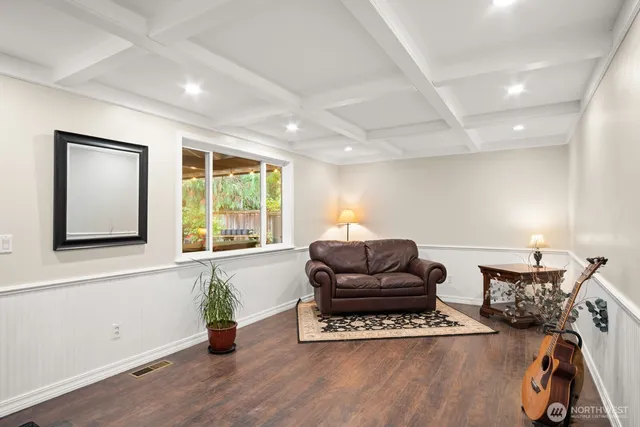 a living room with furniture window and wooden floor