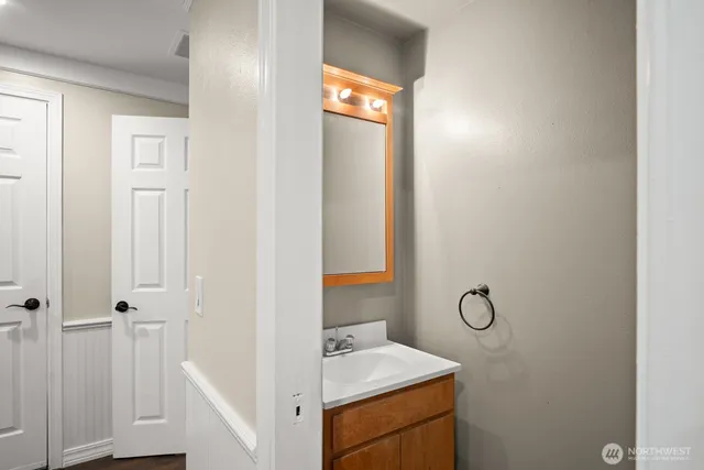 a bathroom with a sink and a mirror