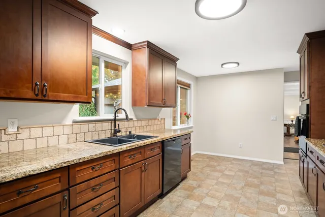 a kitchen with a sink and cabinets