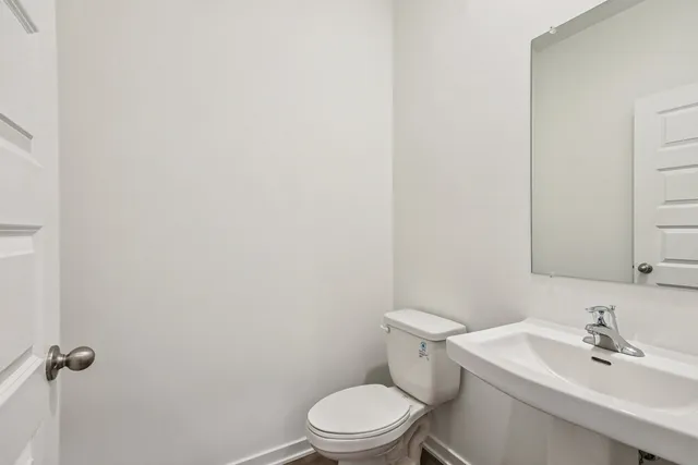 a bathroom with double sink and a mirror