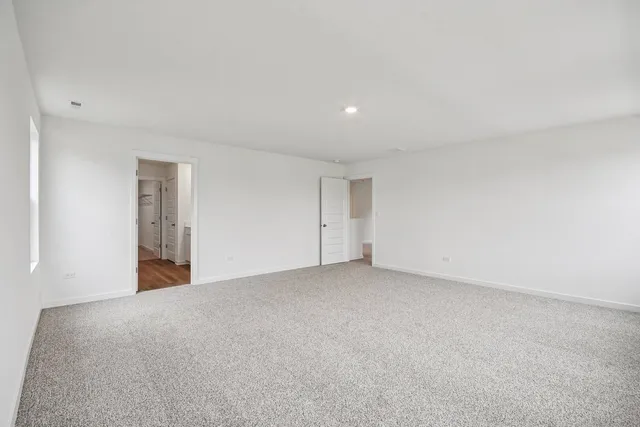 an empty room with closet area