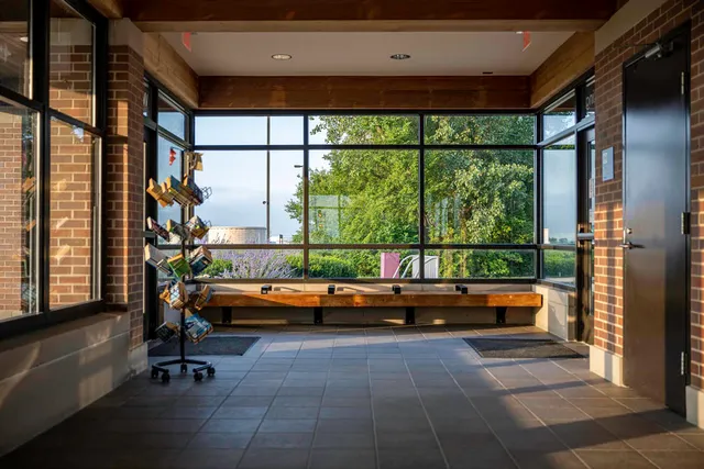 an aerial view of a house with a yard and lake view