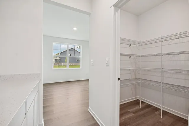 a view of room with window and hardwood floor