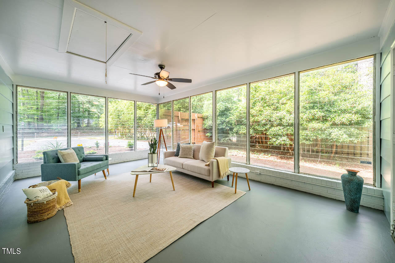 210 Landsbury Drive Durham, NC 27707 - Photo 12 of 20 a living room with furniture and a large window