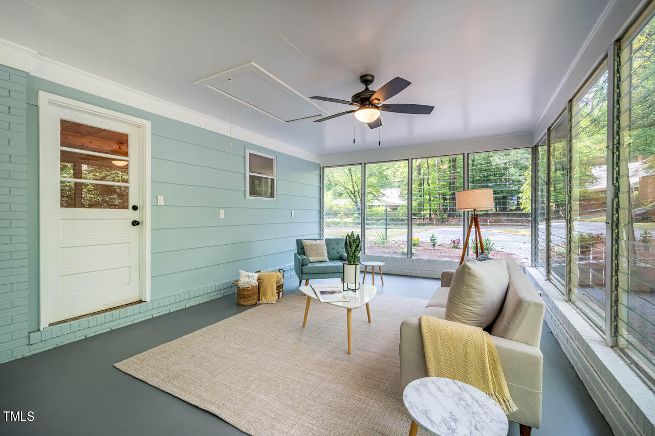 210 Landsbury Drive Durham, NC 27707 - Photo 13 of 20 a living room with furniture and a large window