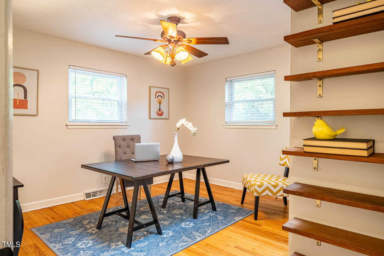 210 Landsbury Drive Durham, NC 27707 - Photo 16 of 20 a workspace with furniture and window