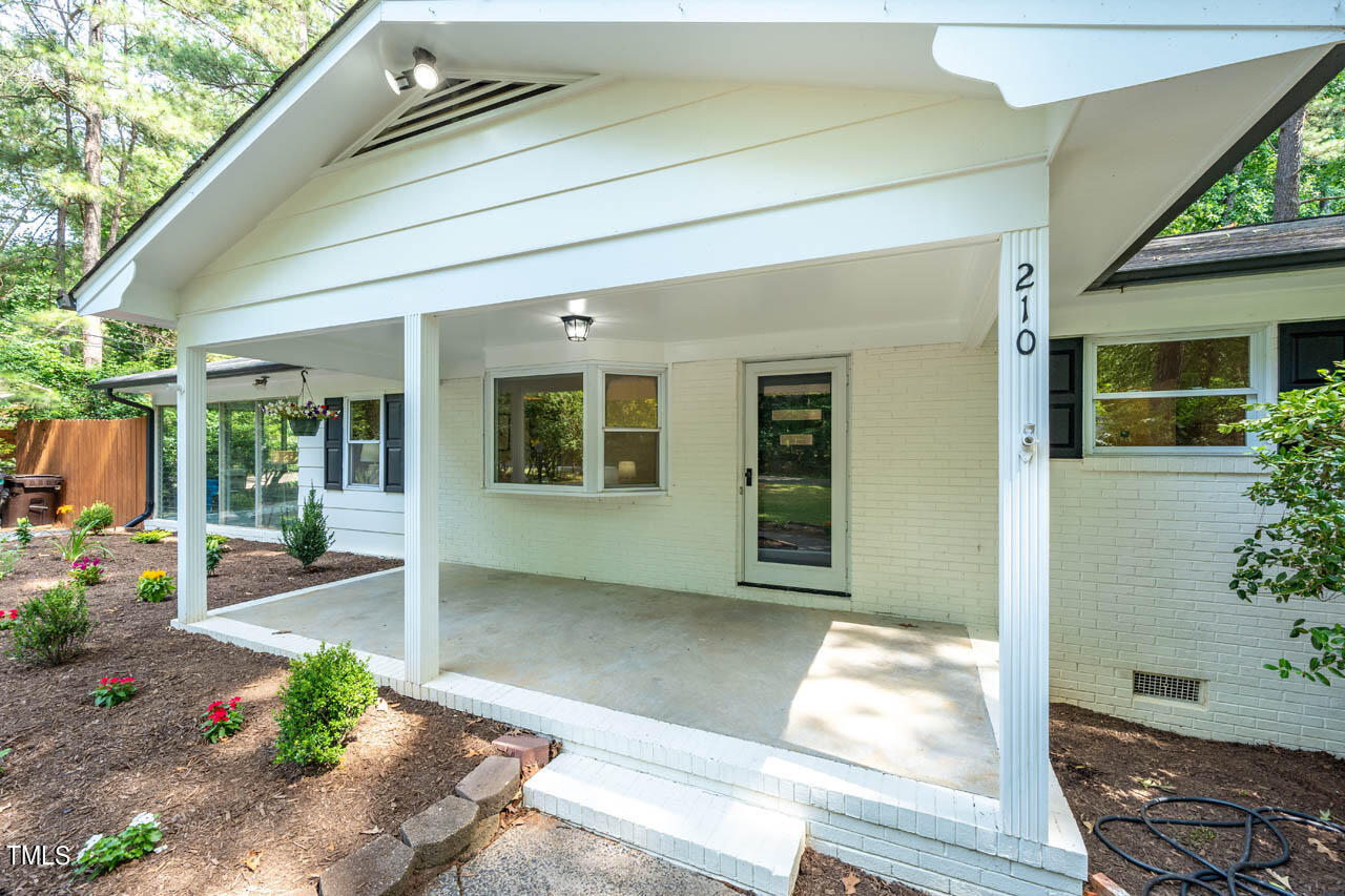 210 Landsbury Drive Durham, NC 27707 - Photo 2 of 20 a house view with a outdoor space