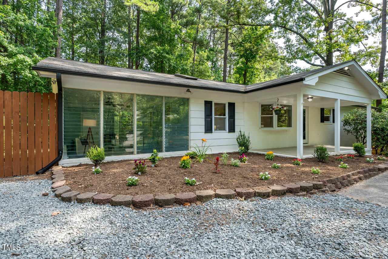 210 Landsbury Drive Durham, NC 27707 - Photo 3 of 20 a view of a house with backyard porch and sitting area