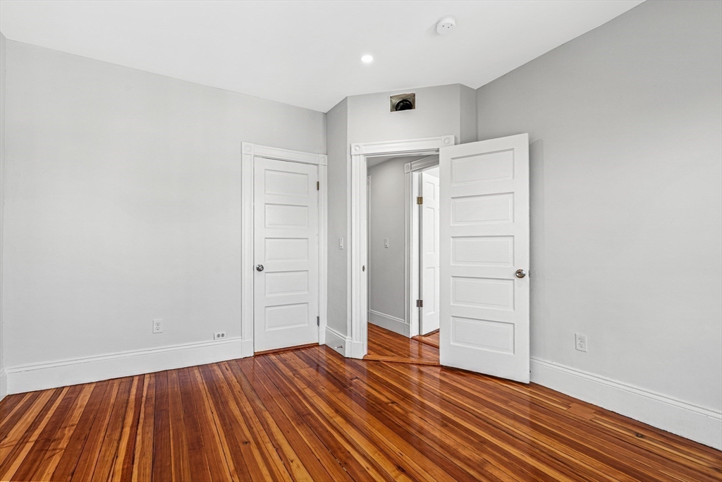 79 Pleasant Street Boston, MA 02125 - Photo 13 of 34 wooden floor in an empty room
