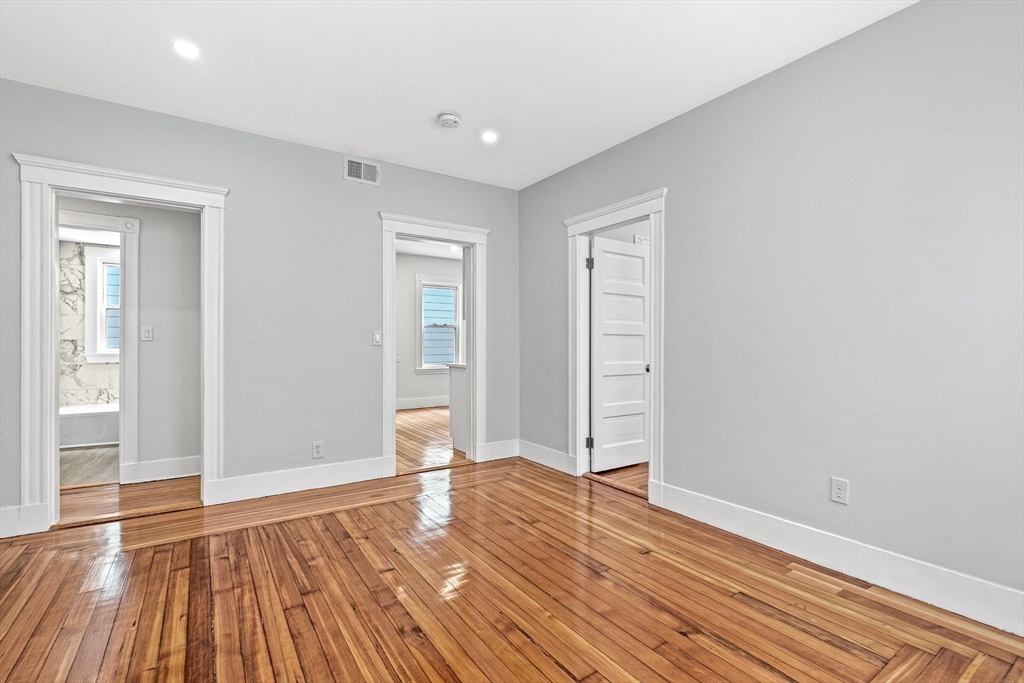 79 Pleasant Street Boston, MA 02125 - Photo 25 of 34 a view of empty room with wooden floor