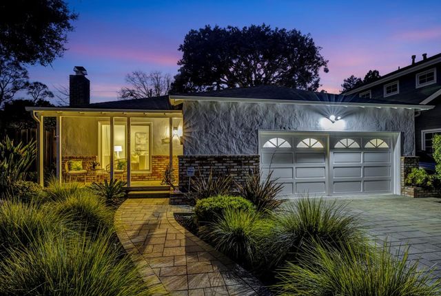 a view of a backyard of the house