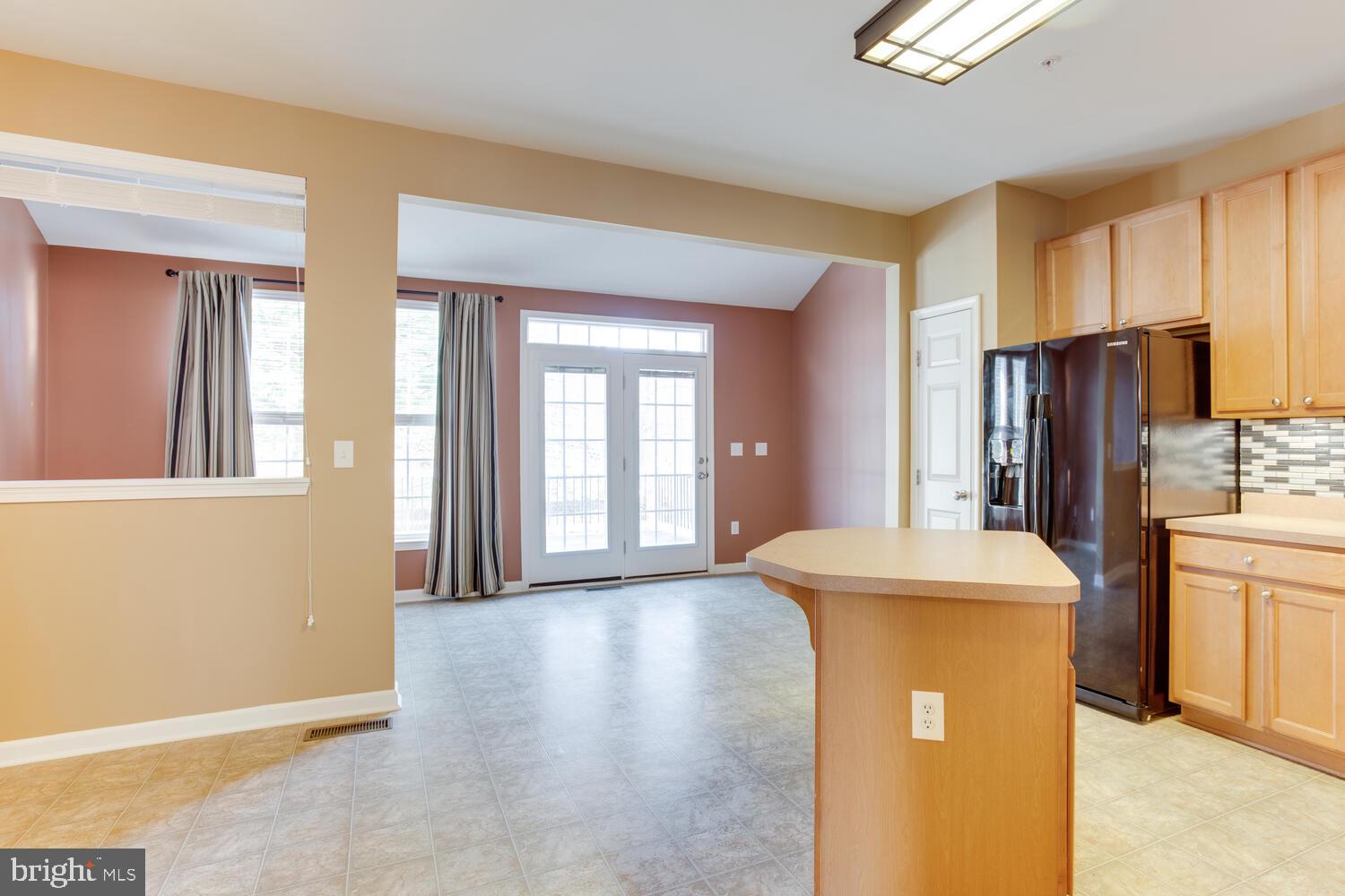 2303 Forest Ridge Terrace, Unit E Chesapeake Beach, MD 20732 - Photo 13 of 73 Kitchen open to the sun room