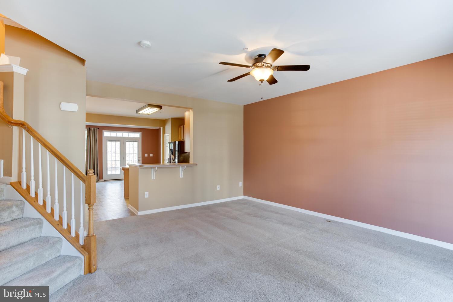 2303 Forest Ridge Terrace, Unit E Chesapeake Beach, MD 20732 - Photo 24 of 73 Living room open to the kitchen.