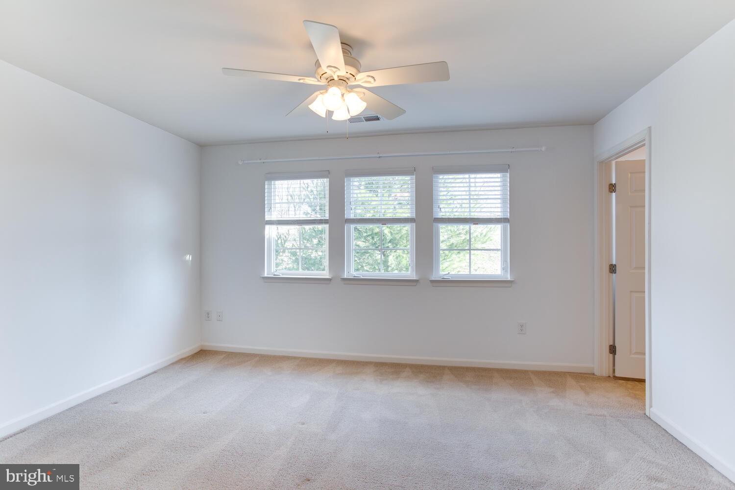 2303 Forest Ridge Terrace, Unit E Chesapeake Beach, MD 20732 - Photo 25 of 73 Primary Bedroom