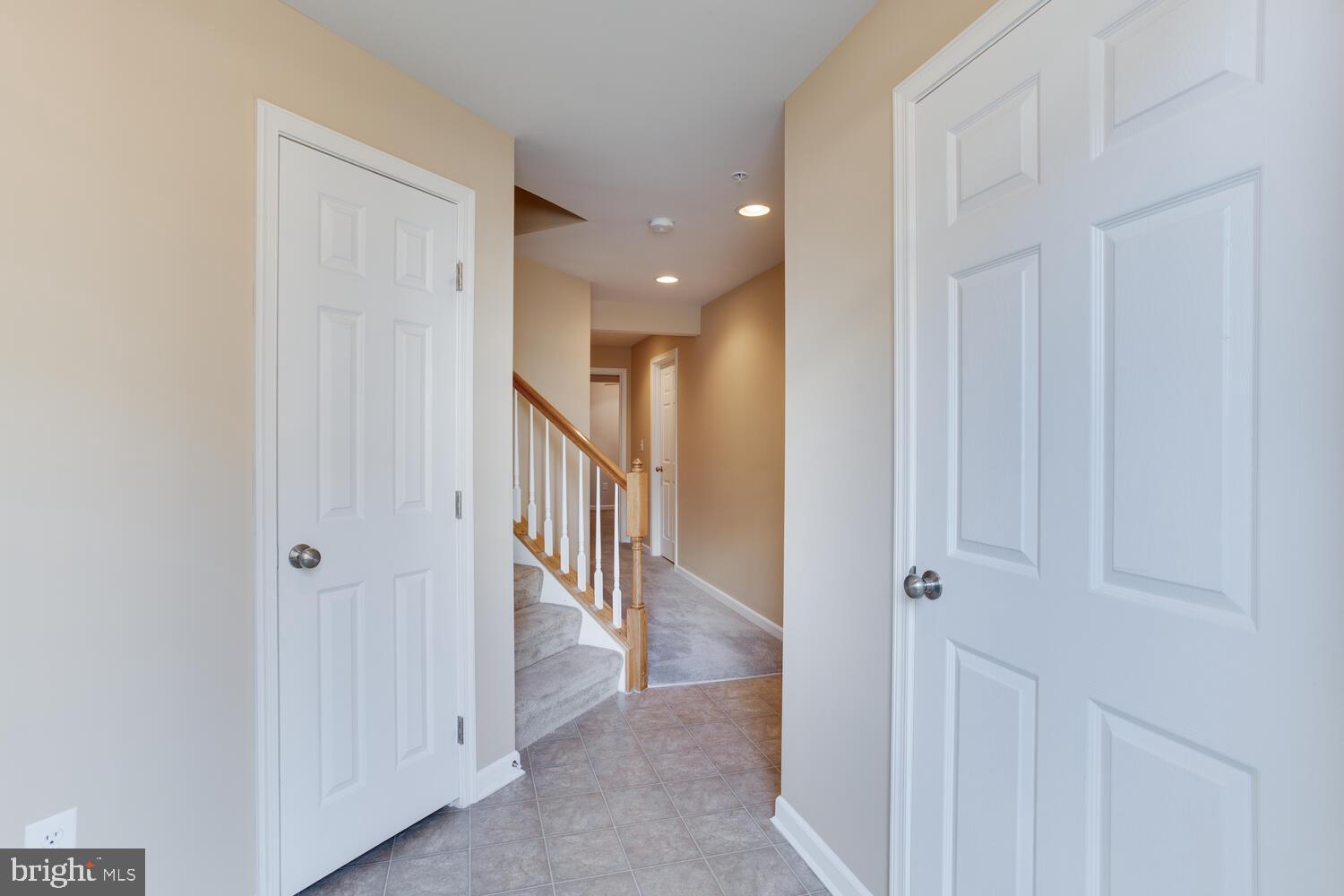 2303 Forest Ridge Terrace, Unit E Chesapeake Beach, MD 20732 - Photo 5 of 73 Entry foyer with two closets